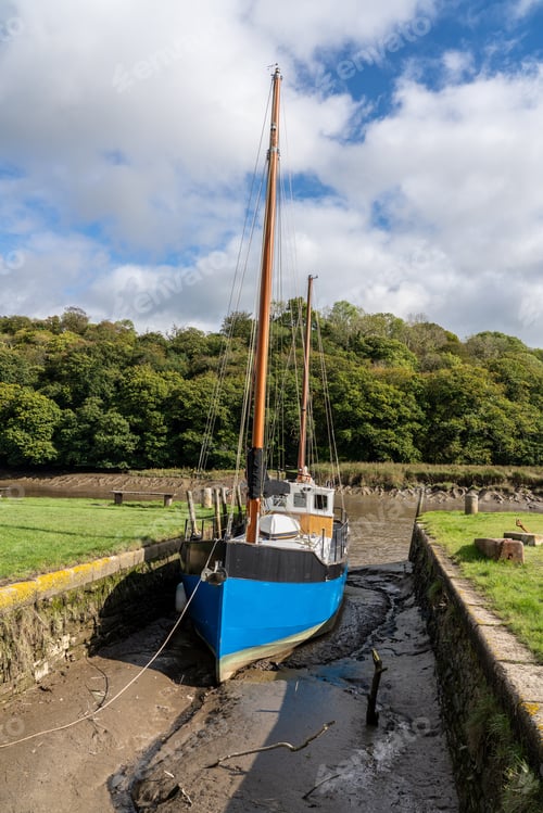 Preview: Blue Fishing Boat In Small Quay Off The Tidal River Tamar At Cotehele In Devon