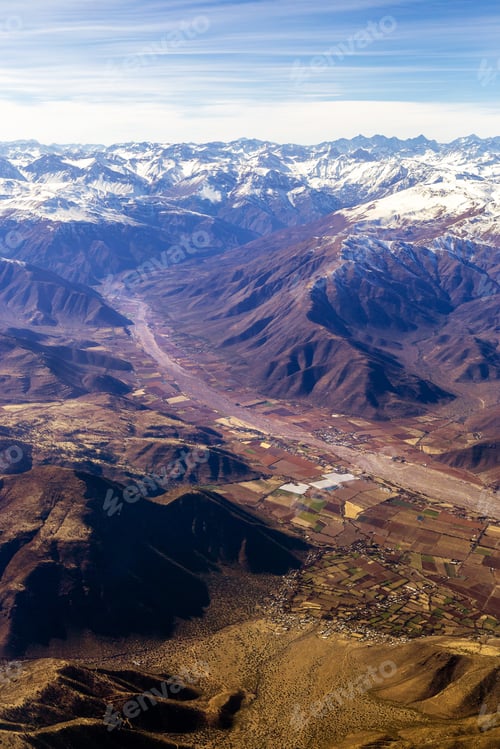 Preview: Aerial View Of A Village Between The Andes Mountain Range With Snow On The Peaks.