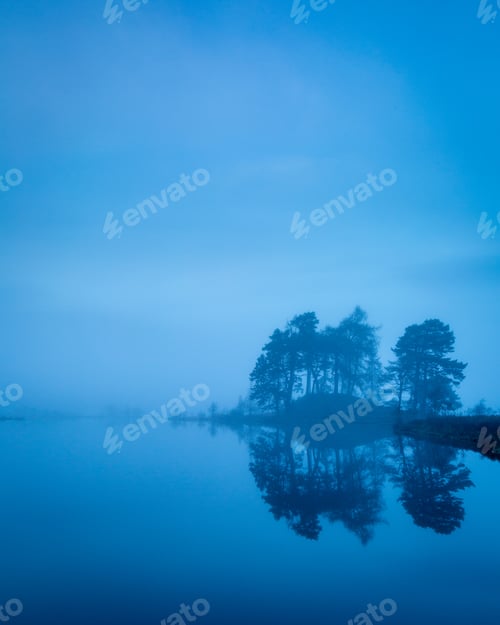 Preview: View Of Loch Tulla In The Highlands Of Scotland In Winter With Trees And Mist In The Foreground