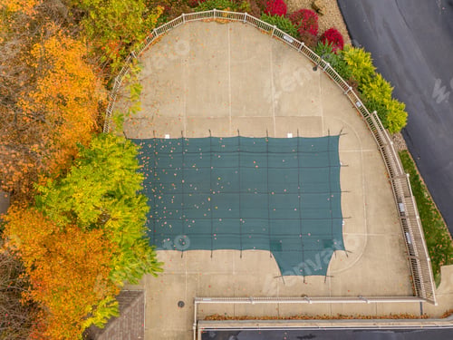 Preview: Aerial Drone Point Of View Of A Green Plastic Cover On Hoa Swimming Pool Protecting It From Leaves