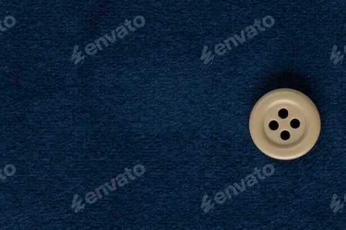 Preview: Clothes Sewing Button On A Blue Fabric Swatch Background