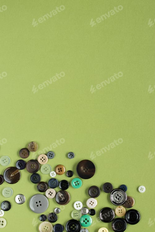Preview: Multi Colored Clothes Sewing Buttons On Green Background