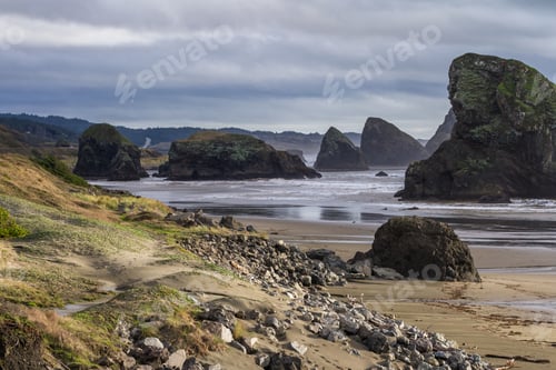Preview: Tranquil Afternoon With Soft Light Breaking Thru The Clouds Adding A Splash Of Color To The Rocks