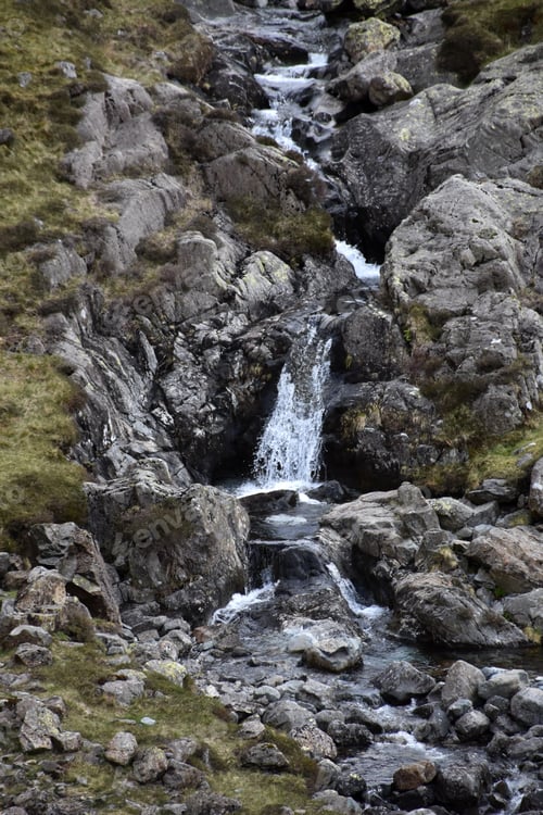 Preview: Lakes District With Water Pouring Down A Mountain Fell.