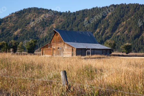 Preview: Barn In A Field Against A Mountain