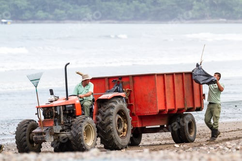Preview: Tambor, Costa Rica - June 25: Hotel Employees Cleaning Up The Beach After A Strom. June 25 2016