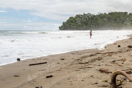 Preview: Beautiful Young Woman Walking On A Lonely Beach In The Costa Rican South Pacific