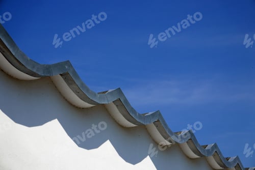 Preview: Facade Of White Building With Wavy Roof