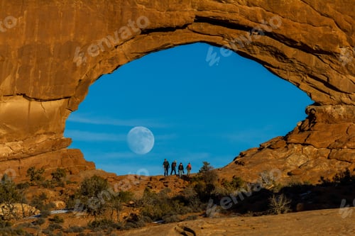 Preview: Arches Np, Utah - December 20: Tourists Enjoying The Full Moon Rising Thru North Window. December