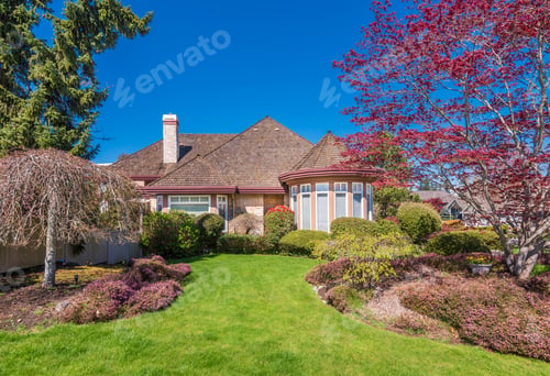 Preview: Beautiful Exterior Of Newly Built Luxury Home. Yard With Green Grass And Walkway Lead To Front