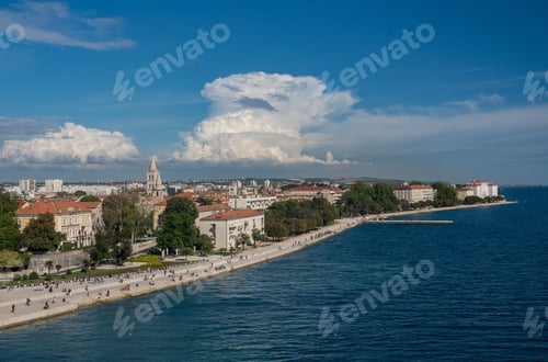 Preview: Tourists On The Steps Of Sea Organ Along The Promenande By The Port Of Zadar In Croatia