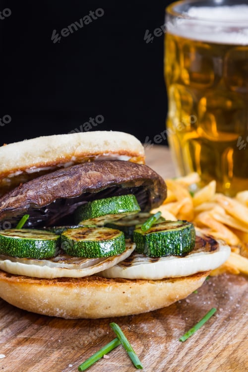 Preview: Vegetarian Sandwich With Grilled Mushroom, Zucchini And Onions Served With Fries And A Cold Beer
