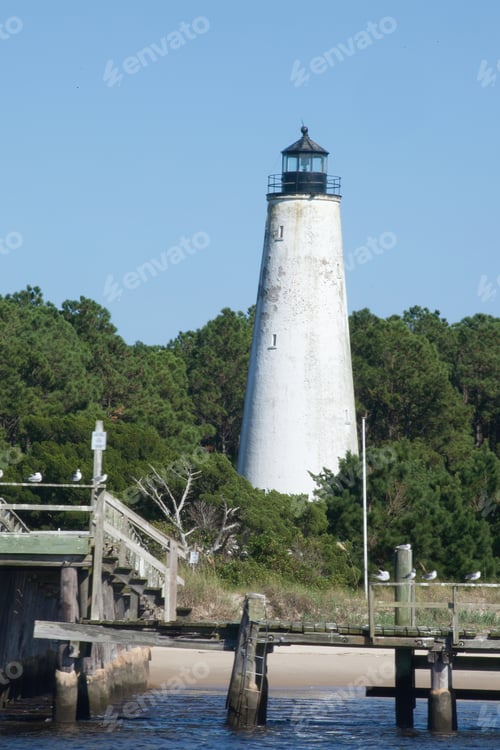 Preview: Lighthouse At The Shore In Some Trees