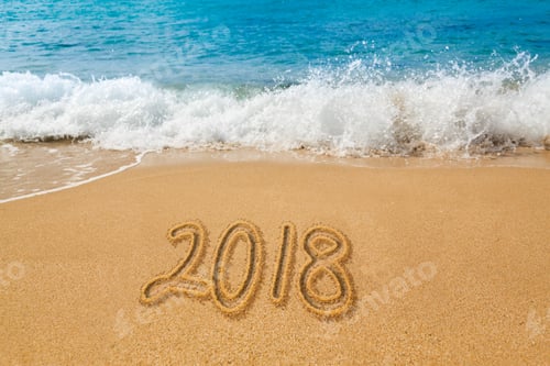 Preview: Sand Drawing On Warm Beach By Ocean Surf In Caribbean Spelling 2018 As An Illustration Of Happy New
