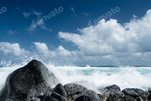 Preview: Cresting Ocean Waves Crash Against Rocks Of Coastline Showing Trails Of Water In The Surf