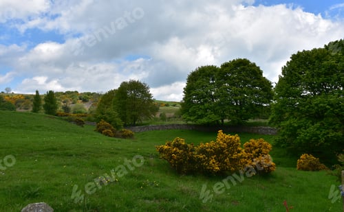 Preview: Landscape With Rolling Hills And Thick White Clouds.