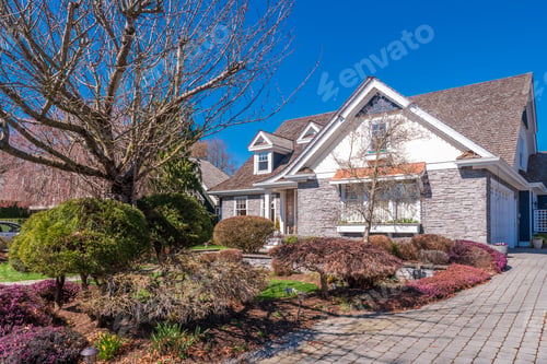 Preview: Beautiful Exterior Of Newly Built Luxury Home. Yard With Green Grass And Walkway Lead To Ornately