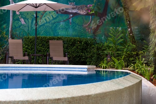 Preview: Uvita, Costa Rica - May 04: Relaxing Swimming Pool With A Hand Painted Jungle Mural In The