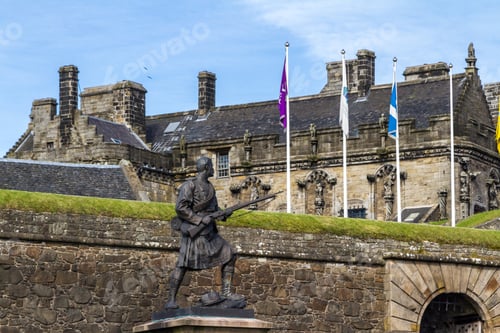 Preview: Stirling, Scotland - September 17 2019: Highlander Soldier Statue Holding A Rifle And His Eyes On
