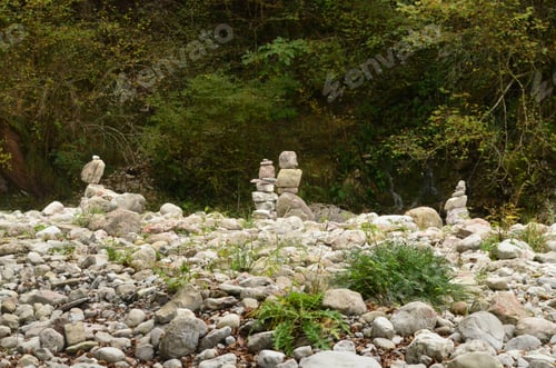 Preview: Peaceful Field Of Rocks With Rocks Stacked On Each Other