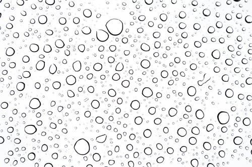 Preview: Close Up Of Rain Drops On A Sunroof On A Cloudy Day From The Interior Of The Car Perspective