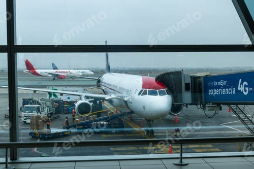Preview: Lima Peru - May 20 : Workers Loading An Airplane For An International Flight With Both Personal And