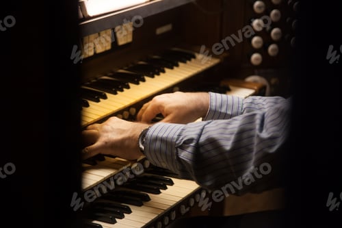 Preview: Mans Hands Playing An Organ