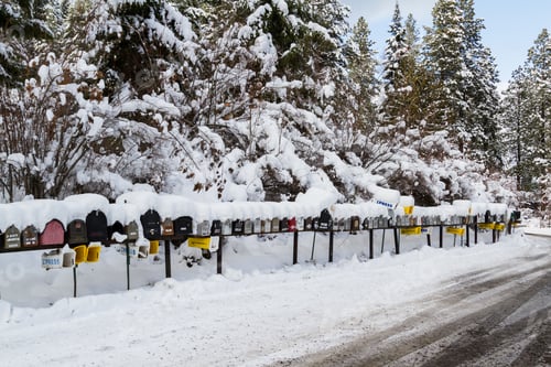 Preview: Coeur D' Alene, Idaho - December 30: Line Of Mailboxes Set Up On The Road Covered In Snow And