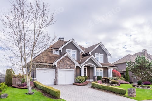Preview: Beautiful Exterior Of Newly Built Luxury Home. Yard With Green Grass And Stone.