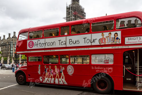 Preview: London - September 06 2019: Iconic Double Decker Bus Touring Westminster With Big Ben In The