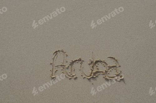 Preview: Smooth Damp Beach Sand With Aruba Written In It.