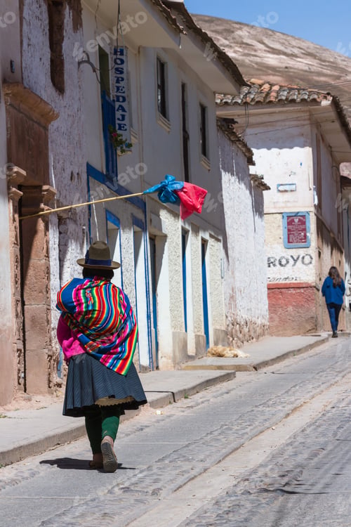 Preview: Maras Peru -May 18 : Local Woman Wearing Beautiful Colors Walking On The Streets Of Maras. May 18