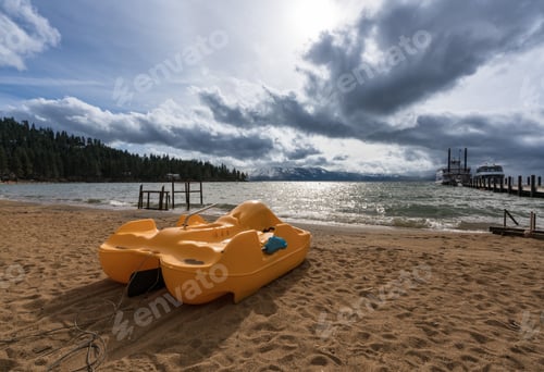 Preview: Empty Pedallo With No Tourists As Cruise Boats Wait For Passengers On Lake Tahoe In Stormy Spring