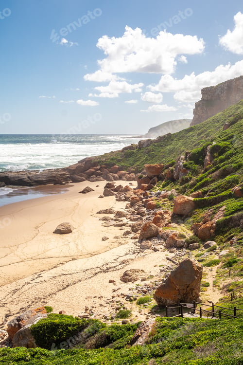 Preview: Portrait Photo Of A Boardwalk With Handrails Going Down To A Deserted Beach On A Sunny Afternoon