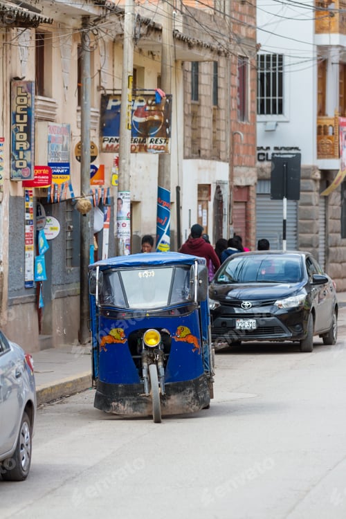 Preview: Pisac, Peru - May 15: Mototaxi A Small Compact Vehicle Making Its Way Thru The Streets Of Pisac