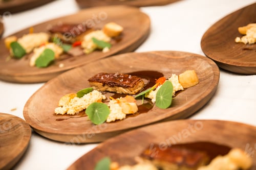 Preview: Meal In A Wooden Plate An People Working On The Preparation.