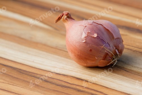 Preview: Close Up Of An Organic Shallot On A Wooden Table