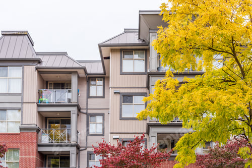 Preview: The Top Of An Apartment Building With Nice Windows.