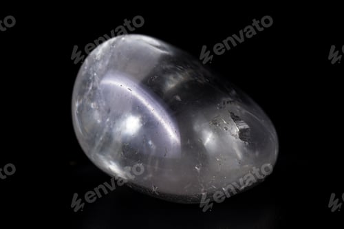 Preview: Close Up Of A Polished Piece Of Clear Quartz Isolated On A Black Background