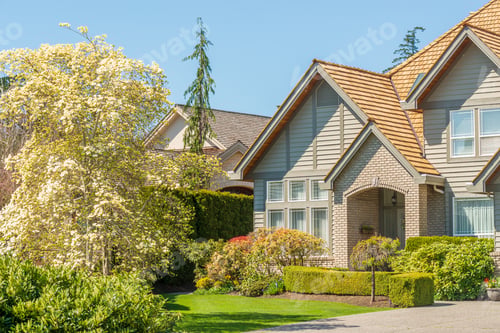 Preview: Fgrament Of Beautiful Exterior Of Newly Built Luxury Home. Yard With Green Grass And Landscape.