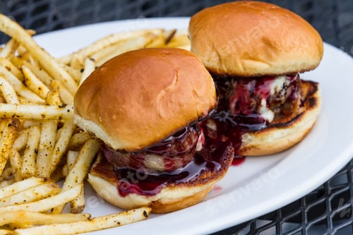 Preview: Delicious gourmet burger sliders with fries on plate