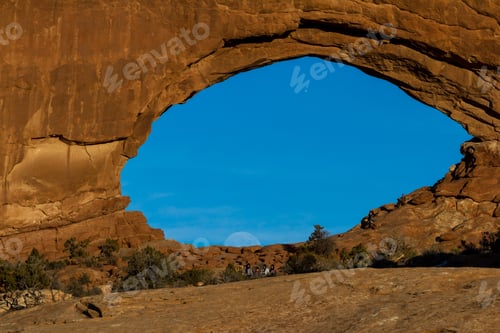 Preview: Arches Np, Utah - December 20: Tourists Enjoying The Full Moon Rising Thru North Window. December