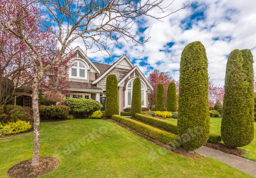 Preview: Beautiful Exterior Of Newly Built Luxury Home. Yard With Green Grass And Stones
