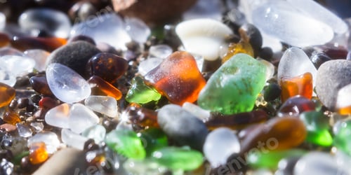Preview: Close Up Of A Group Of Shiny Pieces Of Sea Glass On The Beach Using A Star Filter To Obtain A