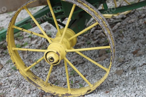 Preview: A Closeup Of A Round Yellow Wagon Wheel And Spokes. 2893