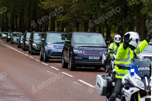 Preview: London - September 06 2019: Government Vehicles Driving On Constitution Hill With A Police Escort