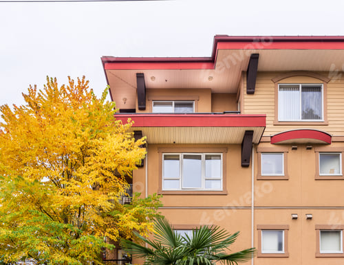 Preview: The Top Of An Apartment Building With Nice Windows.