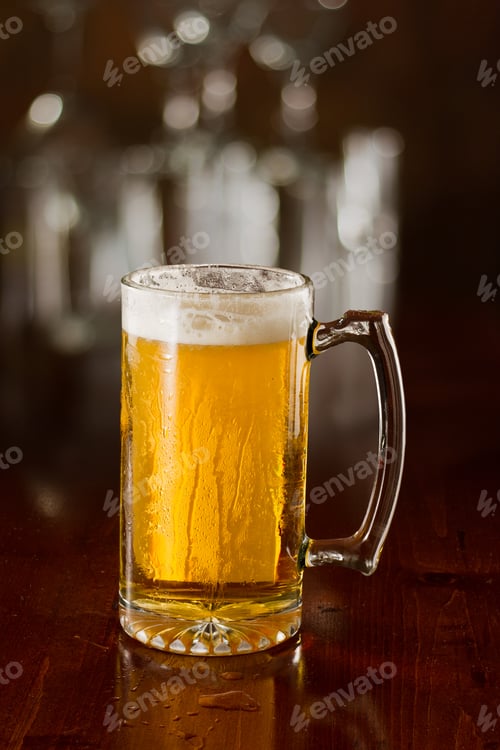 Preview: Cold Beer In A Chilled Mug Served On A Busy Bar Top