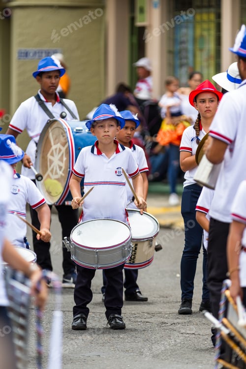 Preview: Tilaran, Costa Rica - September 15 : School Children Marching In The Town Square Playing Percussion