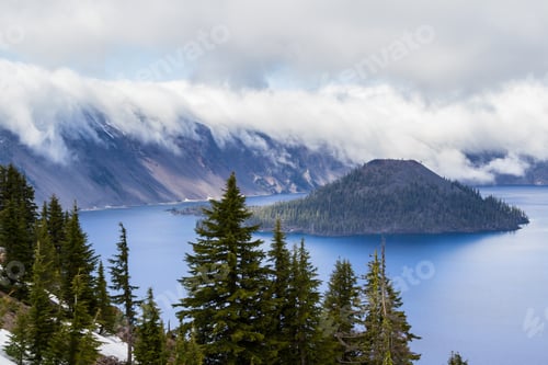 Preview: Beautiful Landscape With A Mysterious Fog Creeping Down Into The Lake With Snow Still Left On The